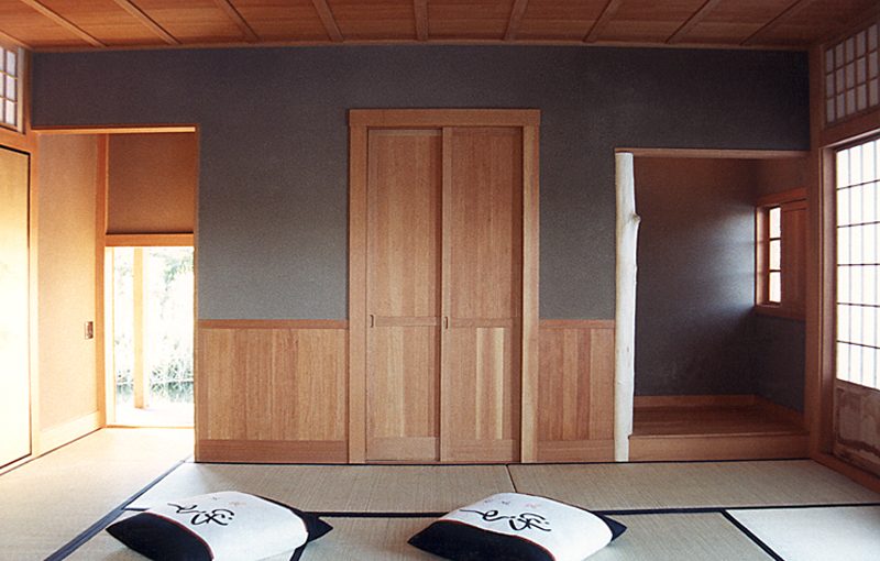 View of Japanese teahouse interior with seating cushions. Designed by Whipple|Callender Architects.